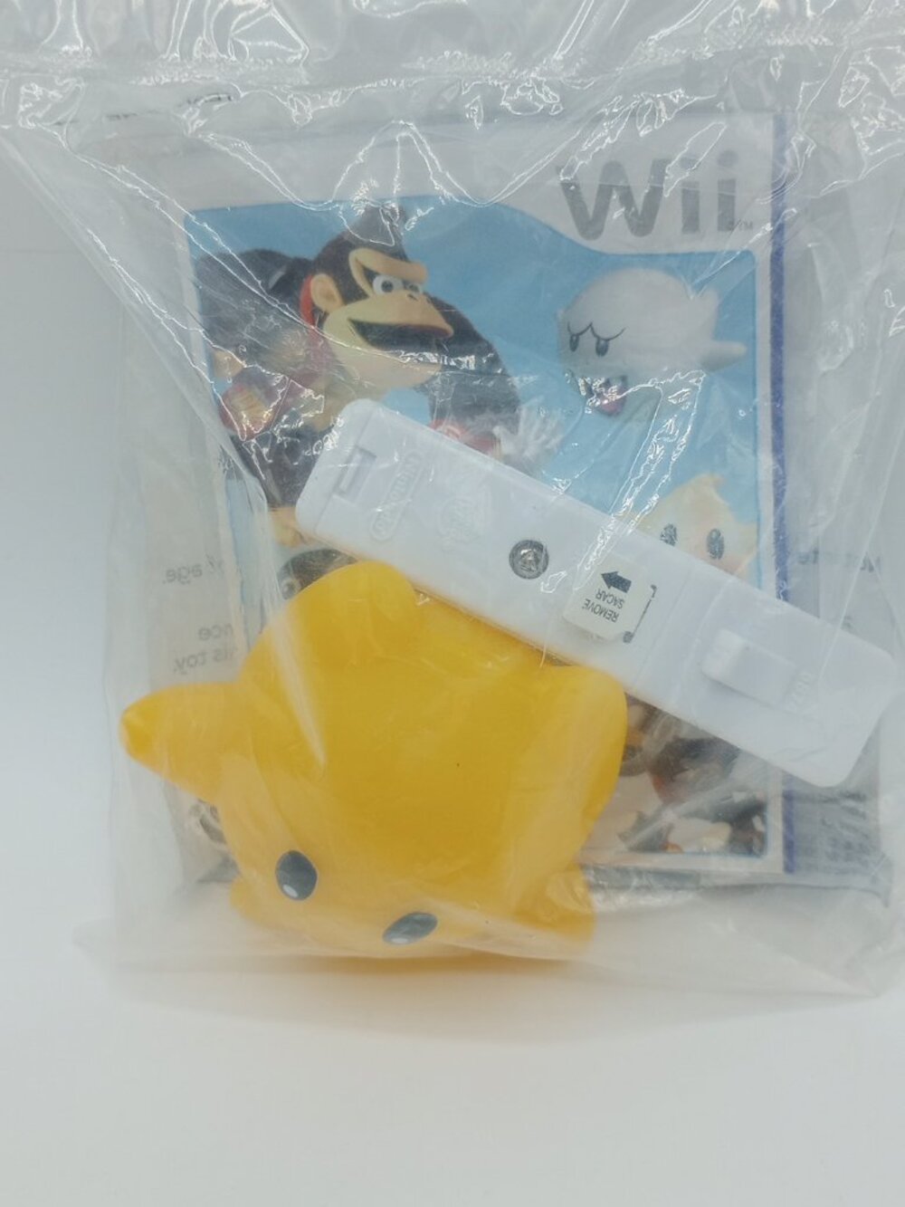 2008 Sealed Super Mario Galaxy Light Up Luma Mini Remote & Booklet - Burger King